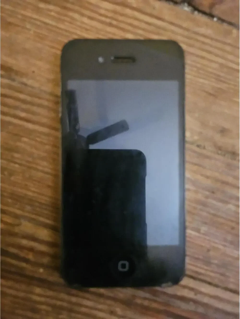 Apple iPhone 4 (i think) - black- charges and powers on. Working. Excellent